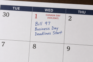 Canada Day (July 1) is shown on a paper calendar with the text "Bill 97 Business Day Deadlines Start"